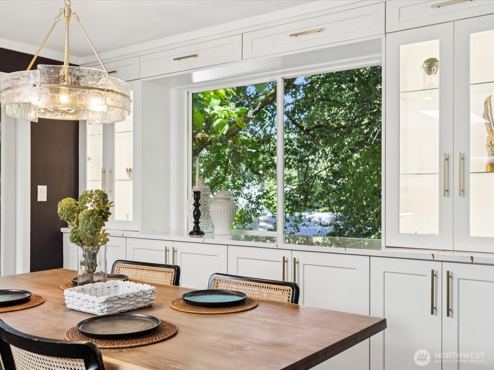View of built in cabinetry in dining space, flanking window