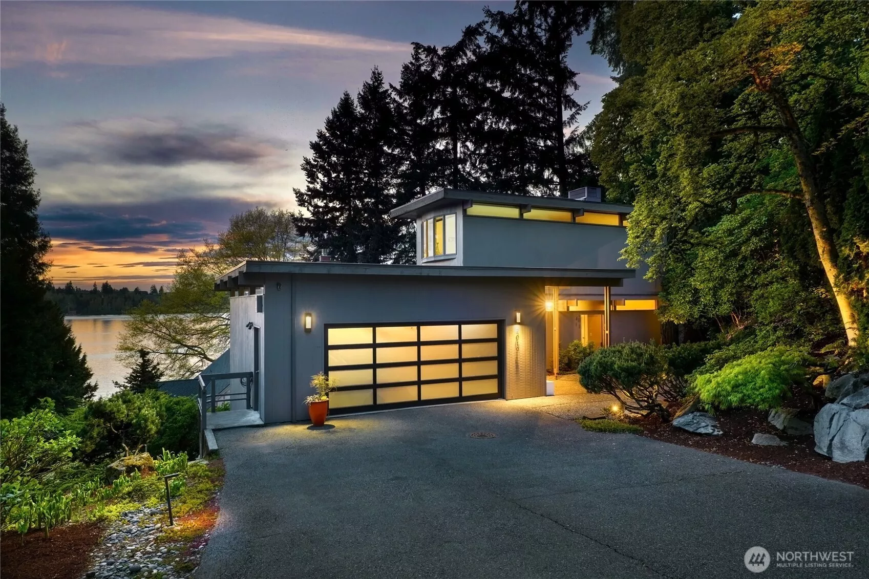 Mid-Century Modern living with Lake Washington views, nestled in a tranquil setting above the shores of Lake Washington. This exquisitely reimagined mid-century modern residence offers a harmonious blend of timeless architecture and sophisticated modern updates. Thoughtfully restored, creates a rare fusion of iconic design, elevated Comfort, and seamless indoor-outdoor living.