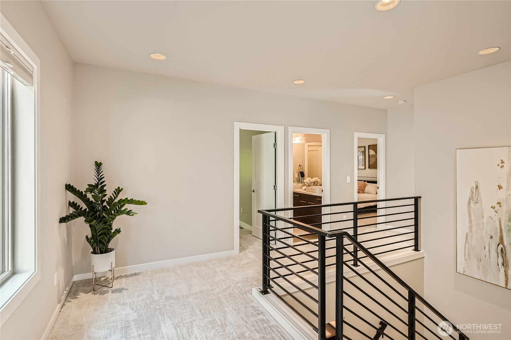 Second level hallway is extra large with space for seating