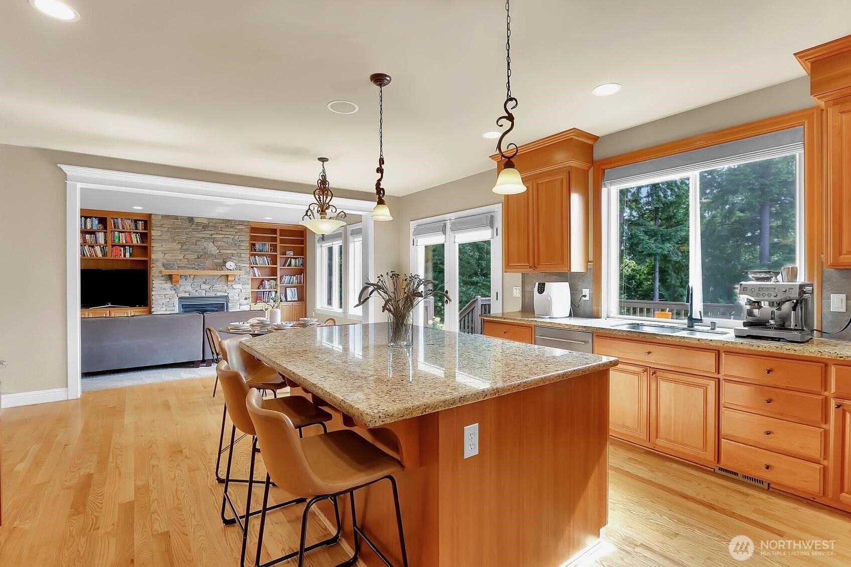 Now this is a kitchen. Eating bar and eating space along with ample counter space.