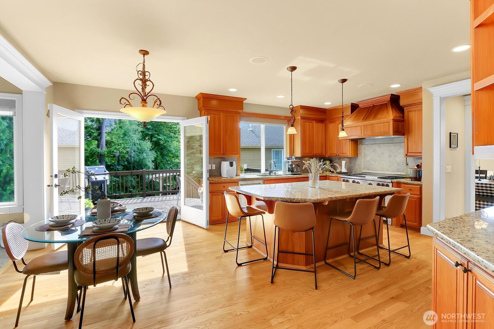 Eating bar allows for four guest, plus additional informal seating area. Double french doors lead to exterior and entertainment sized deck.
