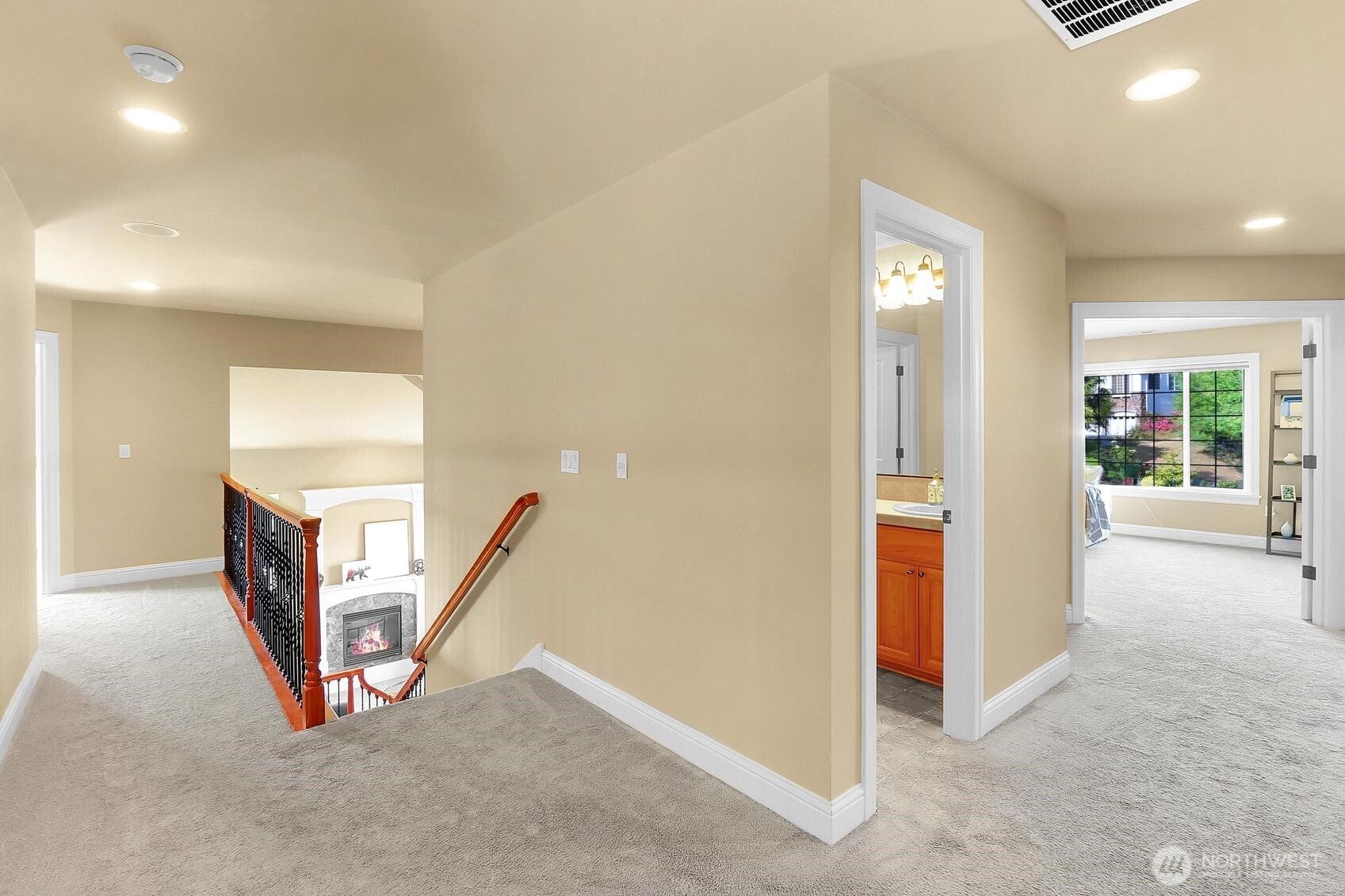Upstairs hallway leading to primary bedroom and upstairs family room.
