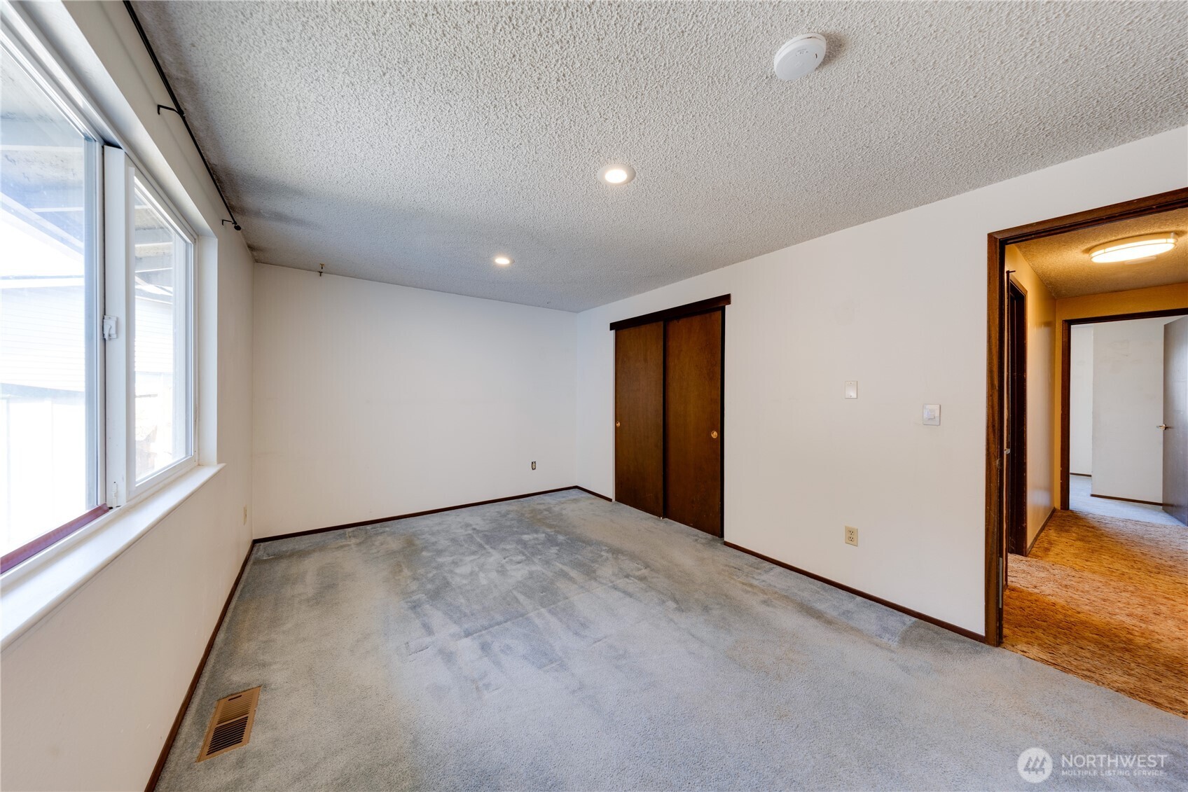 Another view of the primary bedroom