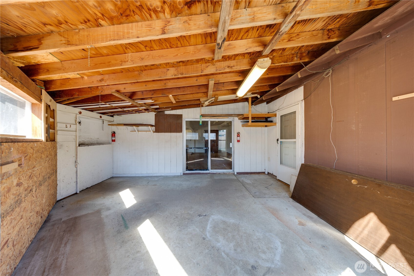 Slider off the big family room to this shop area