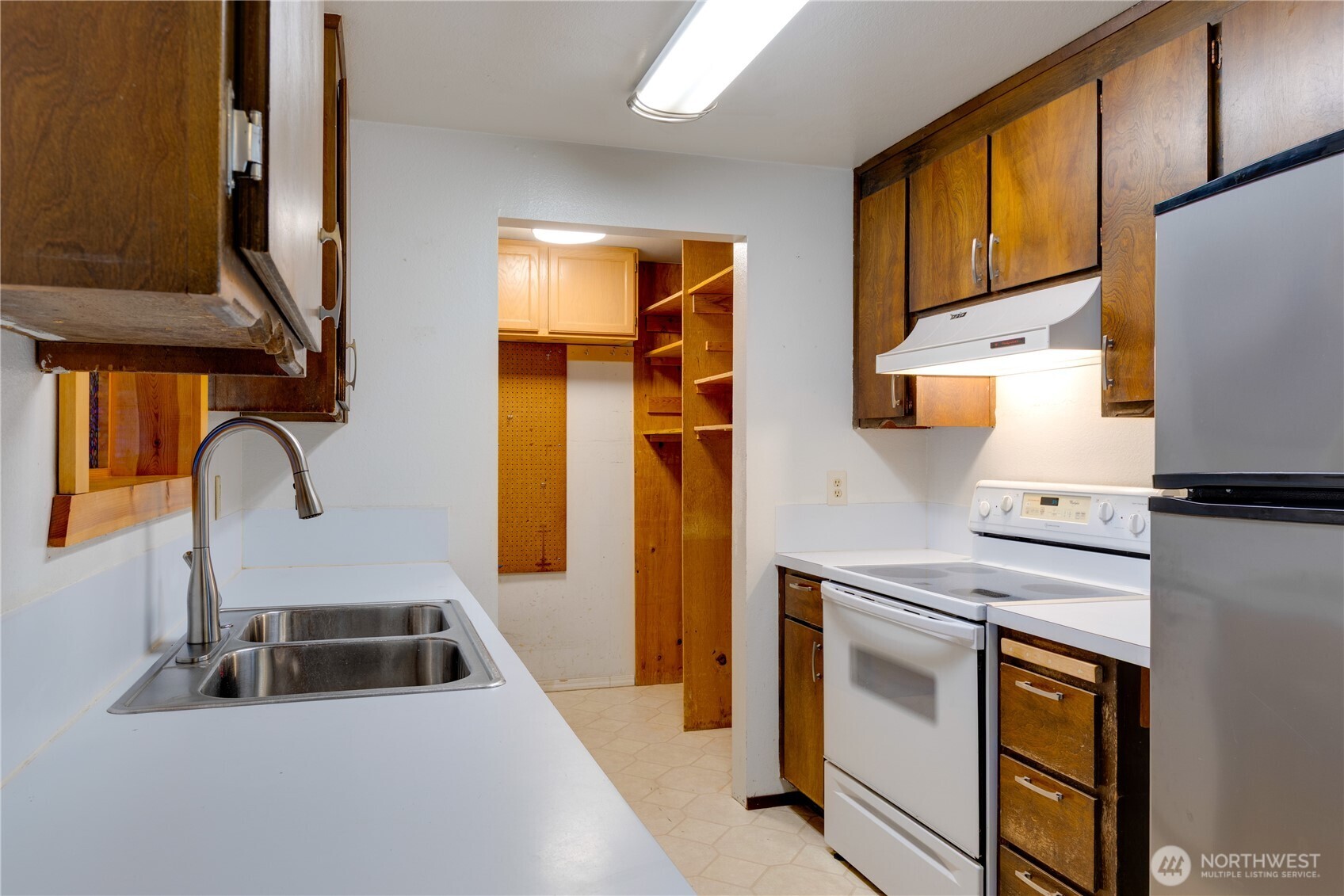 Kitchen opens to the laundry area