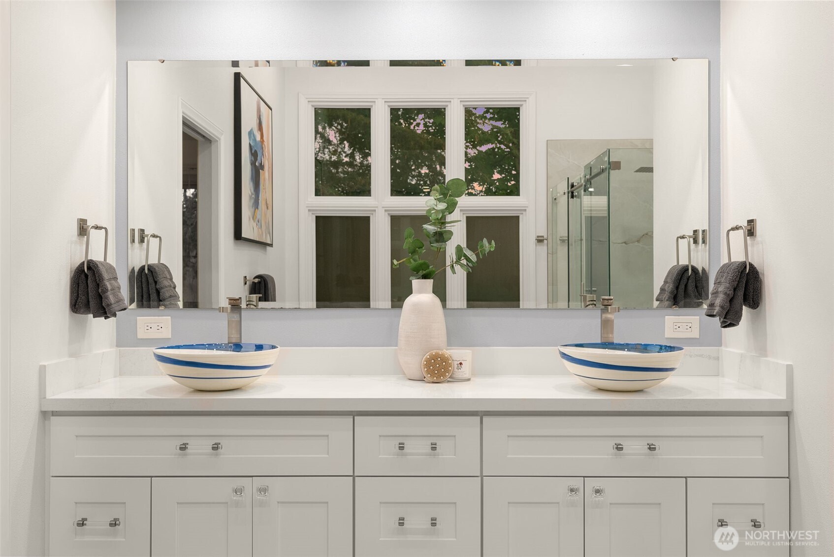 Dual sinks on the primary vanity with ample storage.