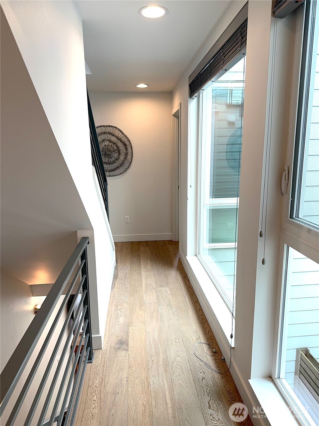 floor to ceiling hall windows w adjustable shades