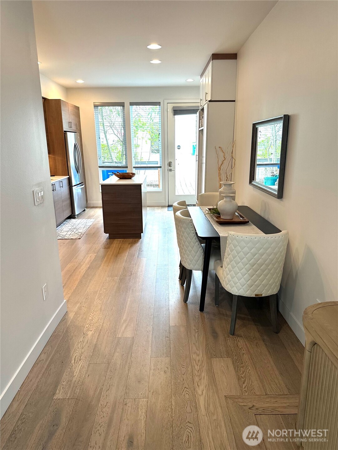 Large windows throughout the main living space and kitchen
