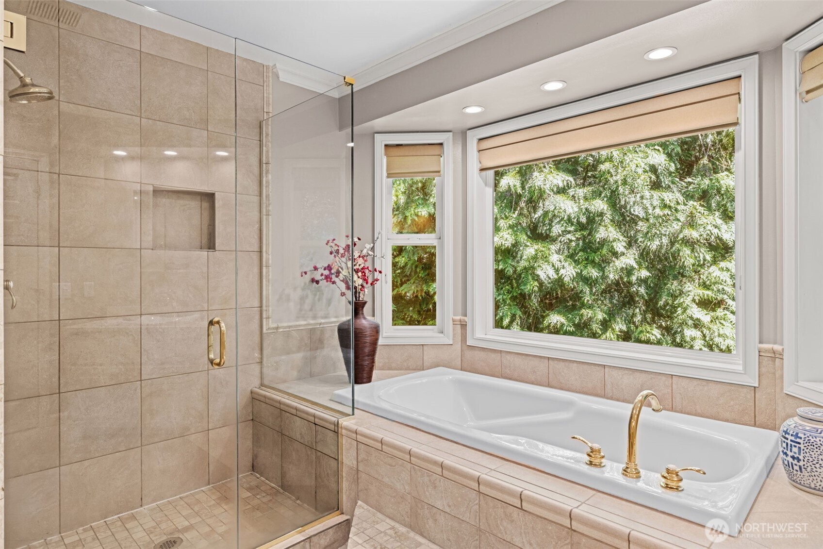 Spacious walk-in shower and large soaking tub with a view!