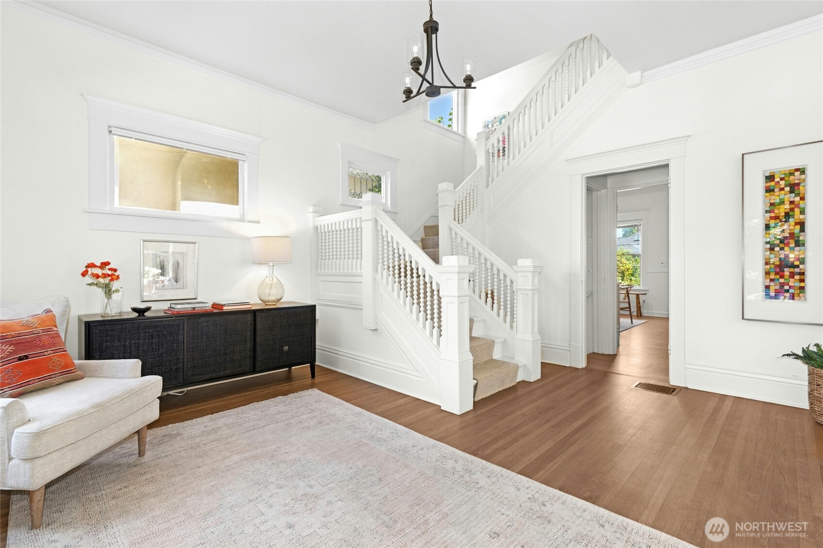 The formal entry is gracious in scale, punctuated with beautifully refinished oak floors and high ceilings.