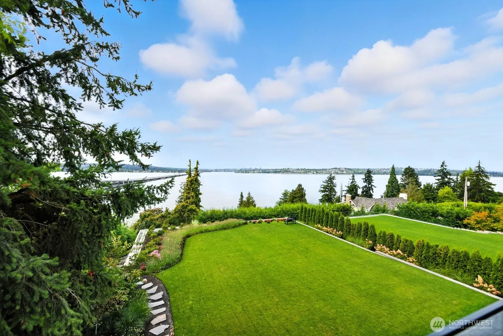 Expansive west-facing lawn and lake views