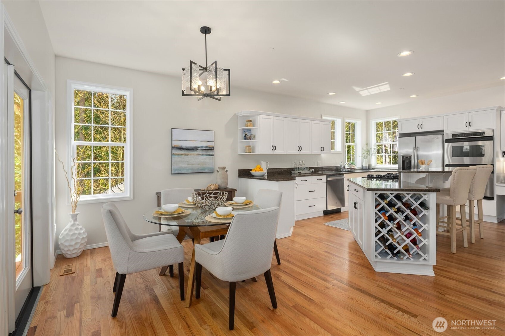 Kitchen area with new hardwood floors.
