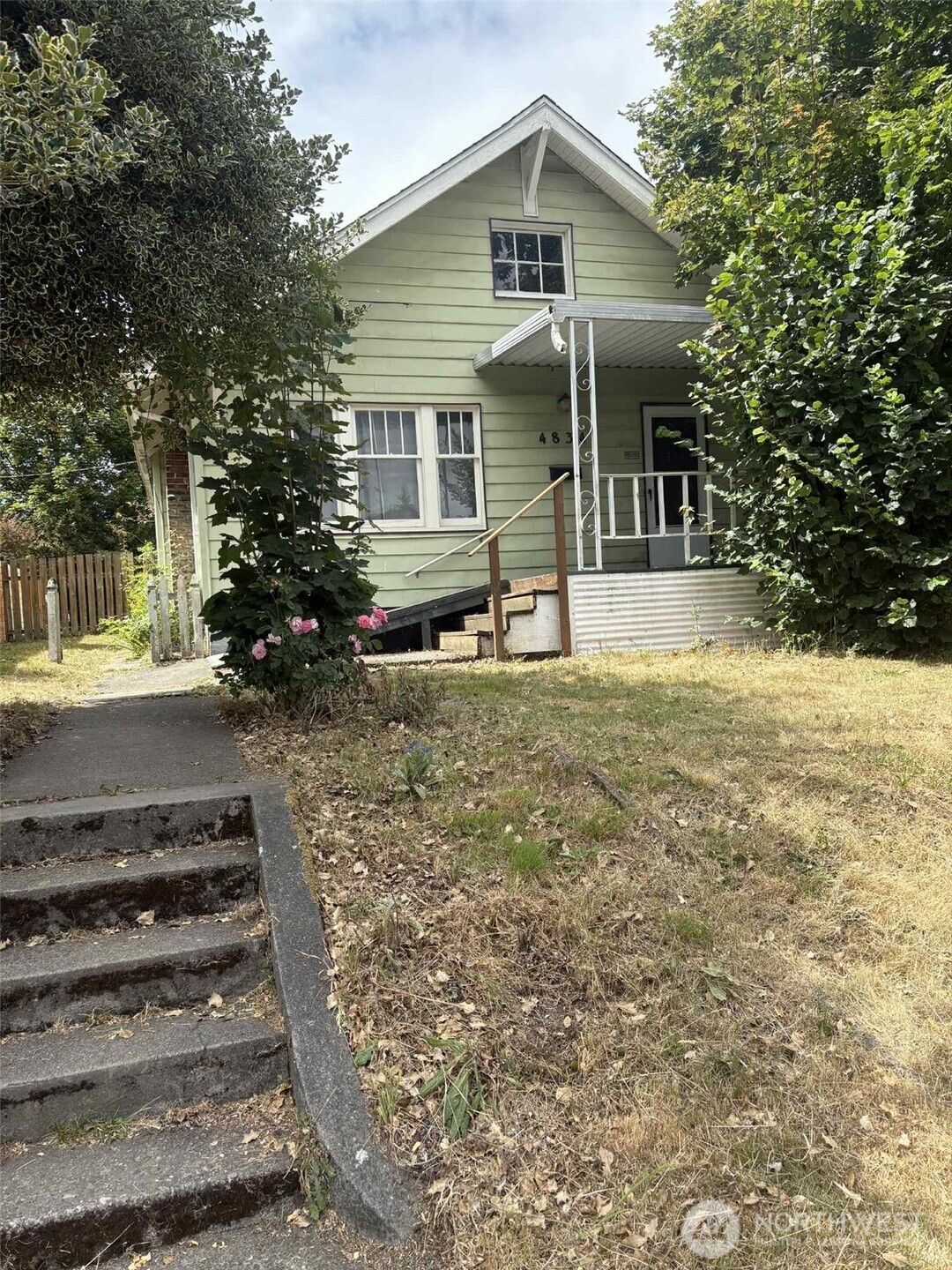 Featuring classic architecture, a covered front porch, and original windows, it’s ready for someone with vision to restore its warmth and character.