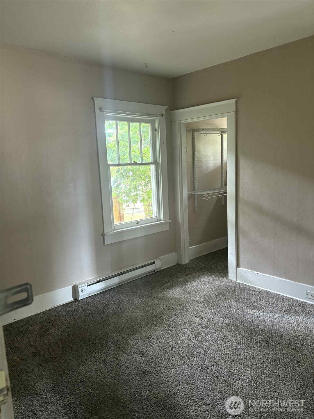 Front Bedroom, 1 of 4! Walk in closet and original windows, woodwork all around.