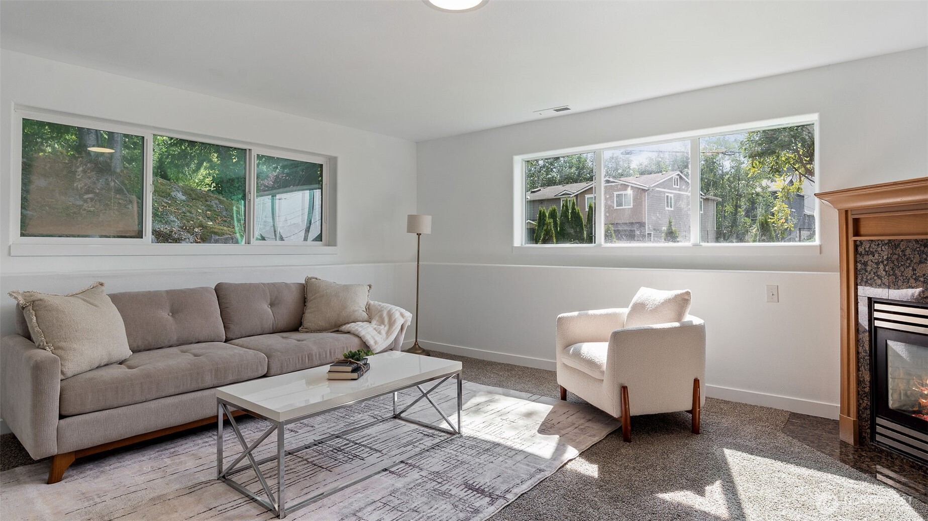 living room with gas burning fireplace