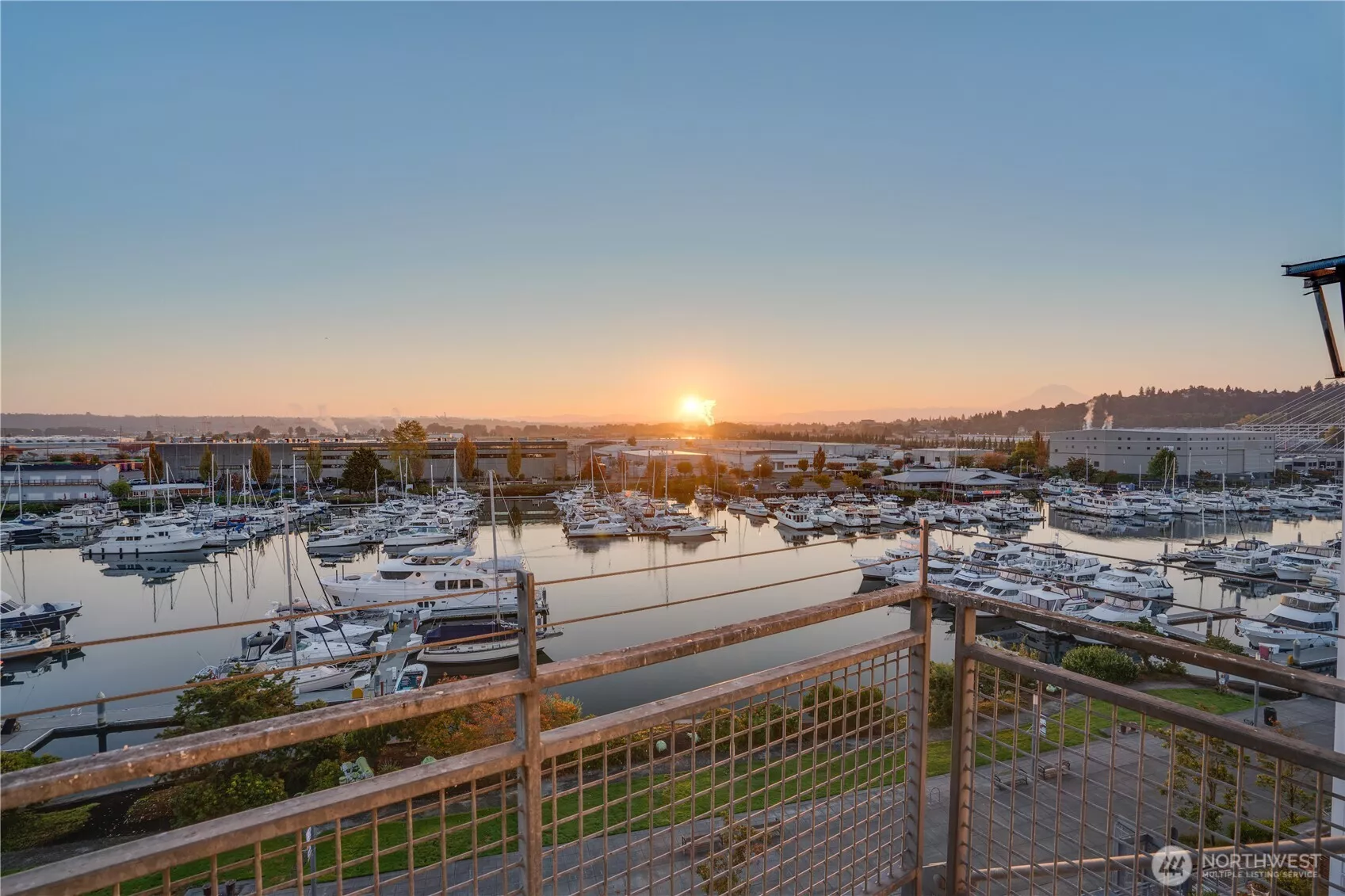 Top floor, 2-story condo. Starting the tour with your private balcony located off of the living room, overlooking Thea Foss Waterway. The sunrise, views of Mt. Rainier and boat activity never dull.