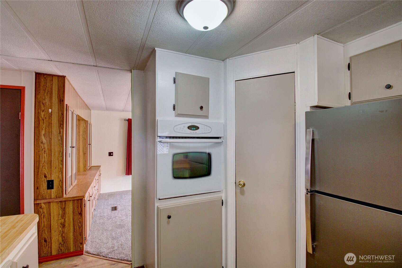 Wall oven and to the right is a nice sized pantry.