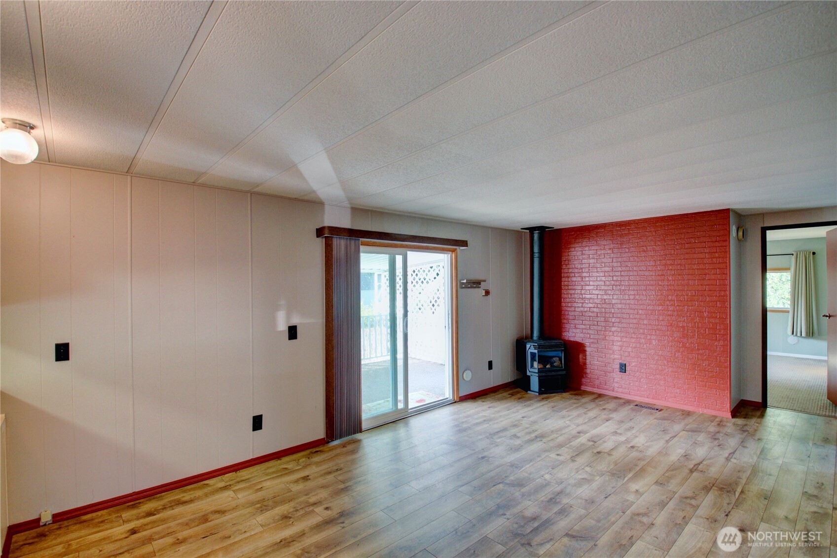 Family room has deck access through the sliding glass doors.