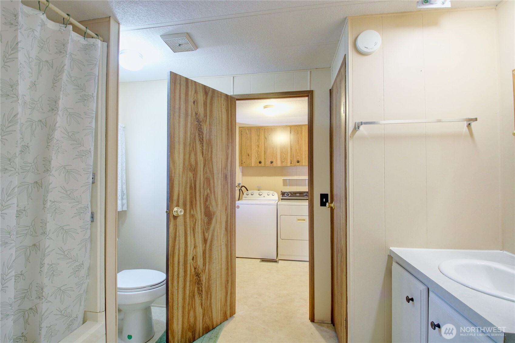 Guest bathroom has access from the laundry room. Large full bath.