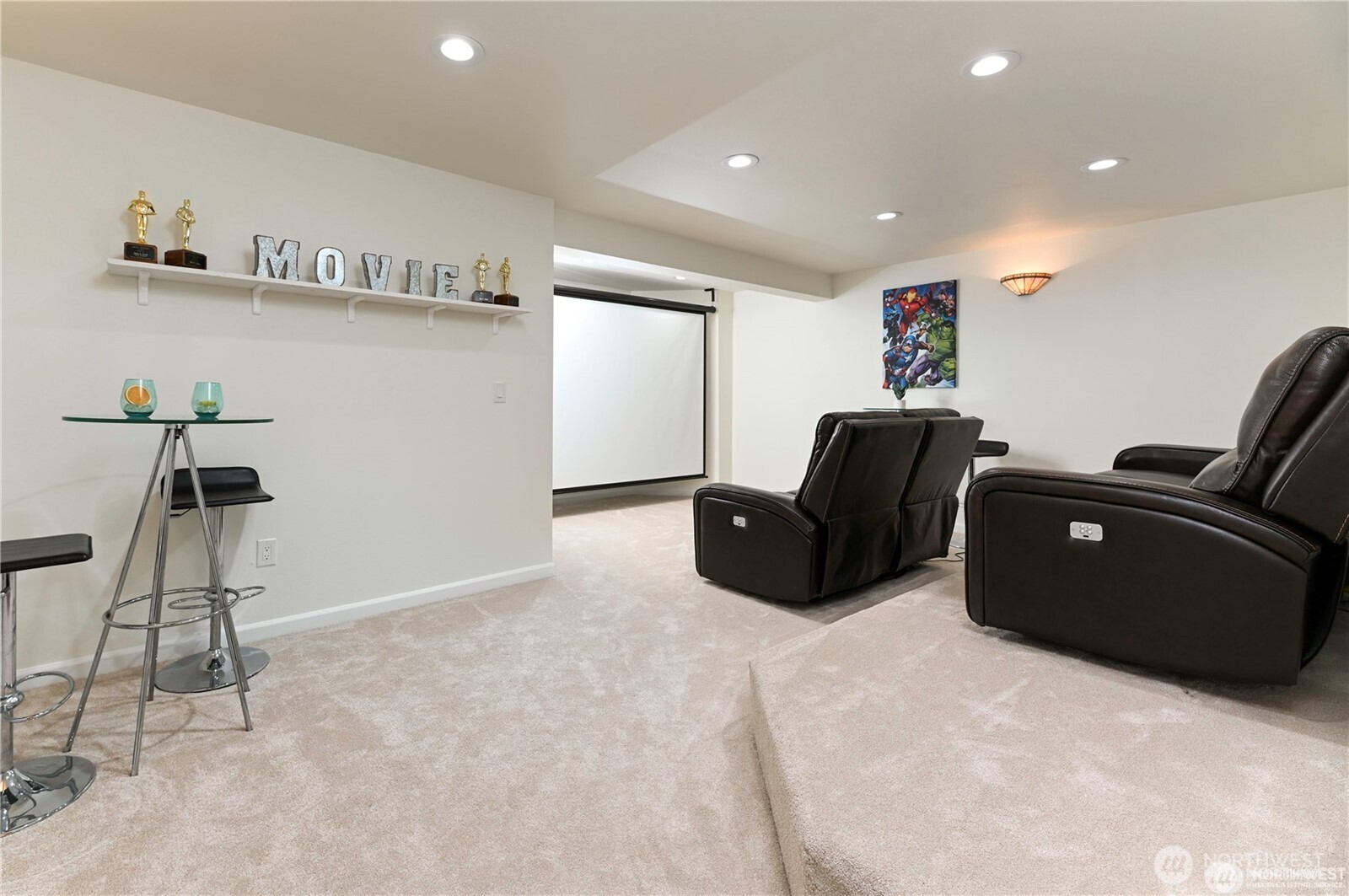 Enjoy an immersive movie experience in the multilevel custom designed media room with drop down screen, custom lighting, luxurious carpets and tiered seating for optimal viewing and comfort.