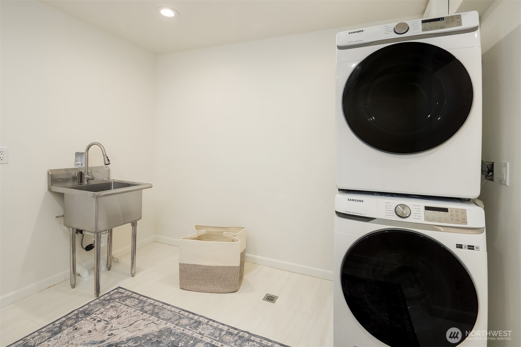 The basement includes a spacious secondary laundry and utility room.