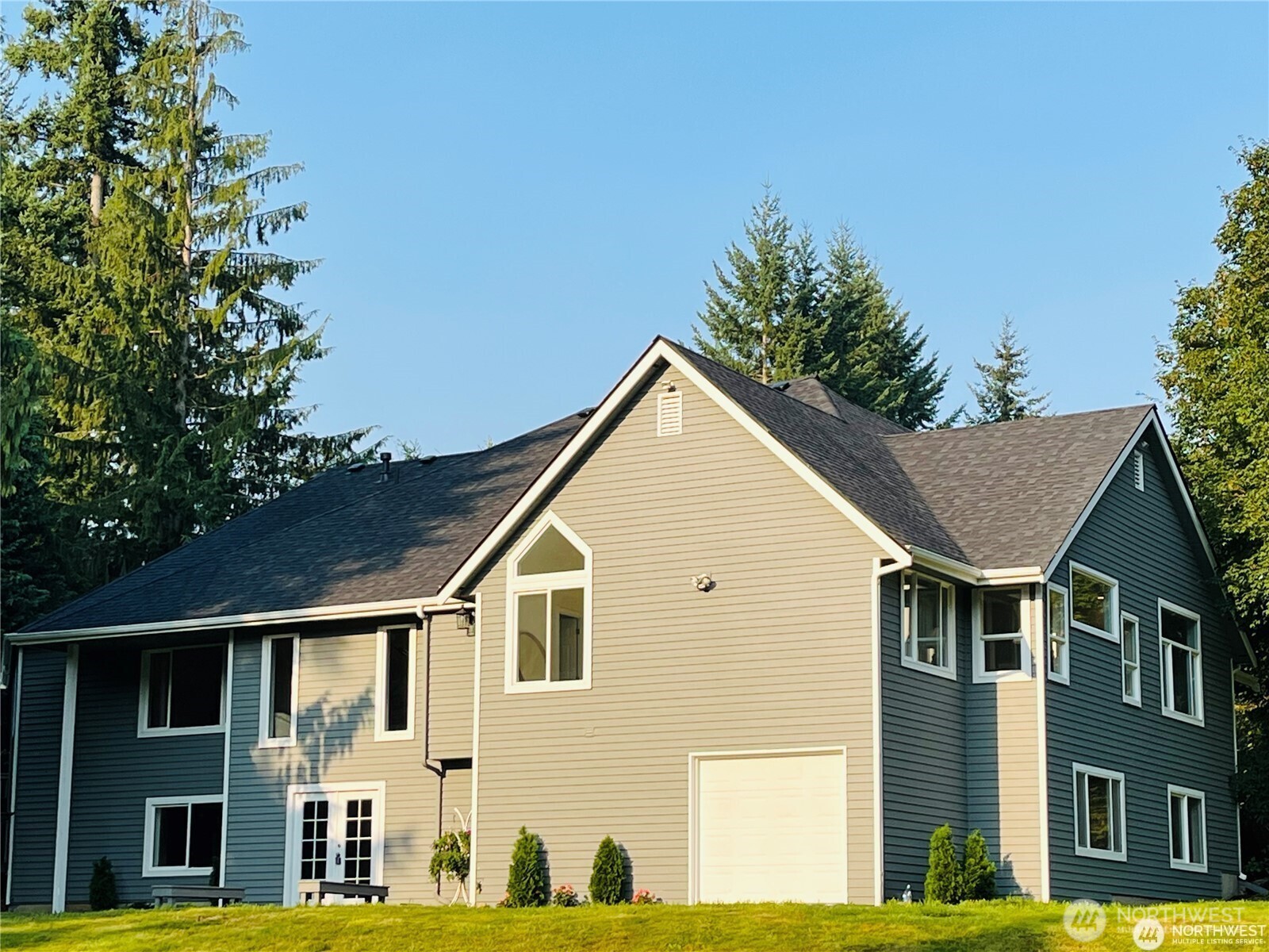 The new exterior paint and new roof enhances the home's fresh and updated appearance.