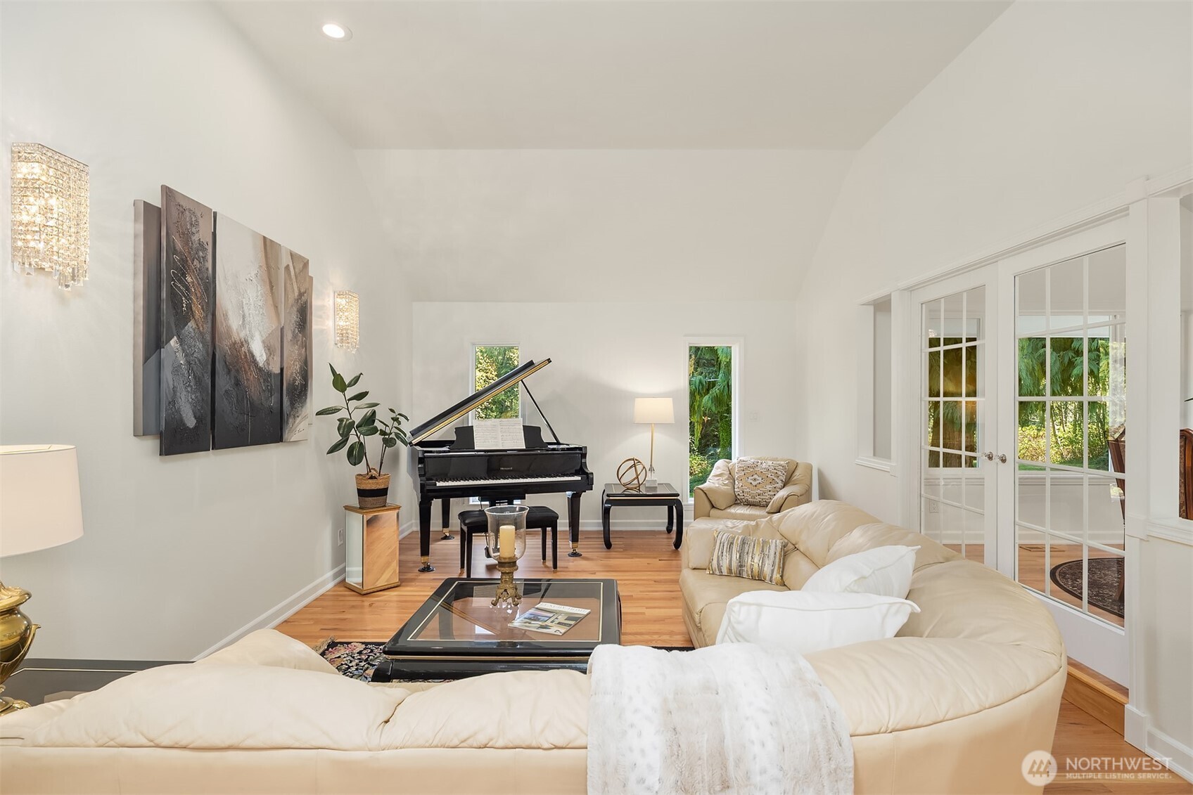 Sophisticated formal living room with classic architectural details, natural light, and a welcoming atmosphere ideal for entertaining guests or quiet relaxation.