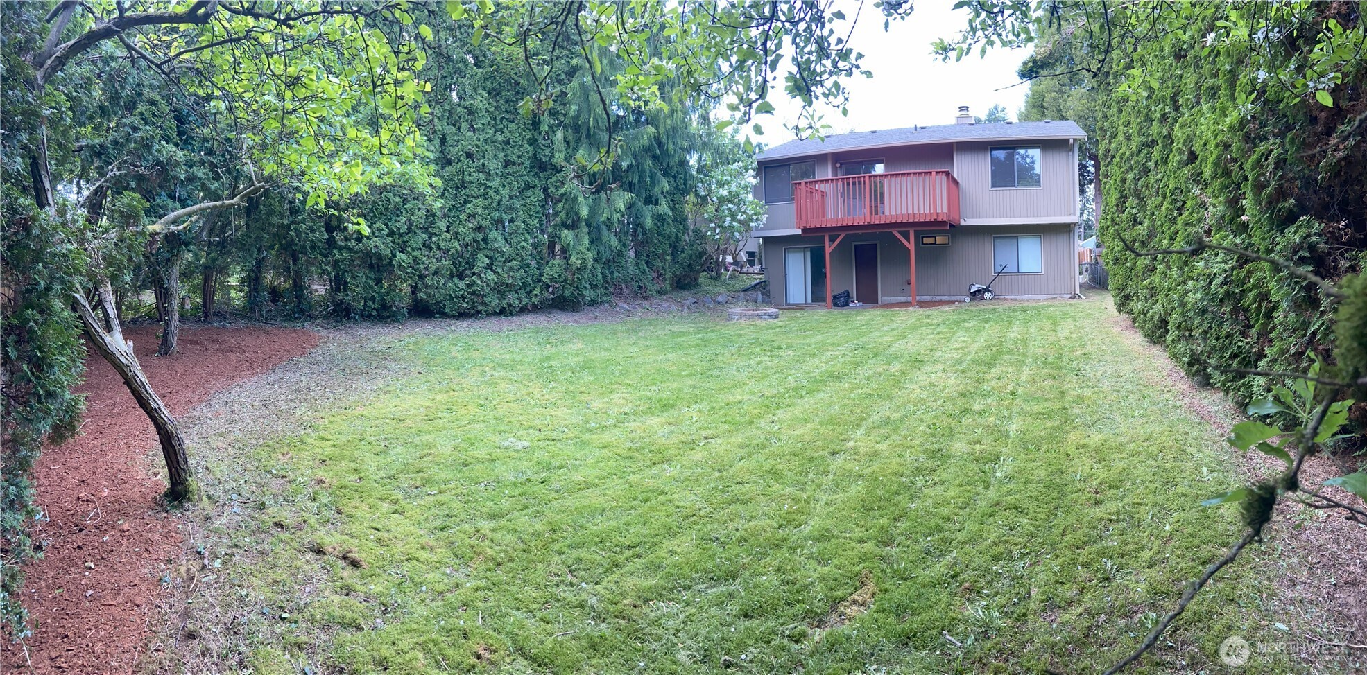 Look at this backyard!!  Such a great spot for BBQ, play area, or just a peaceful place to relax.
