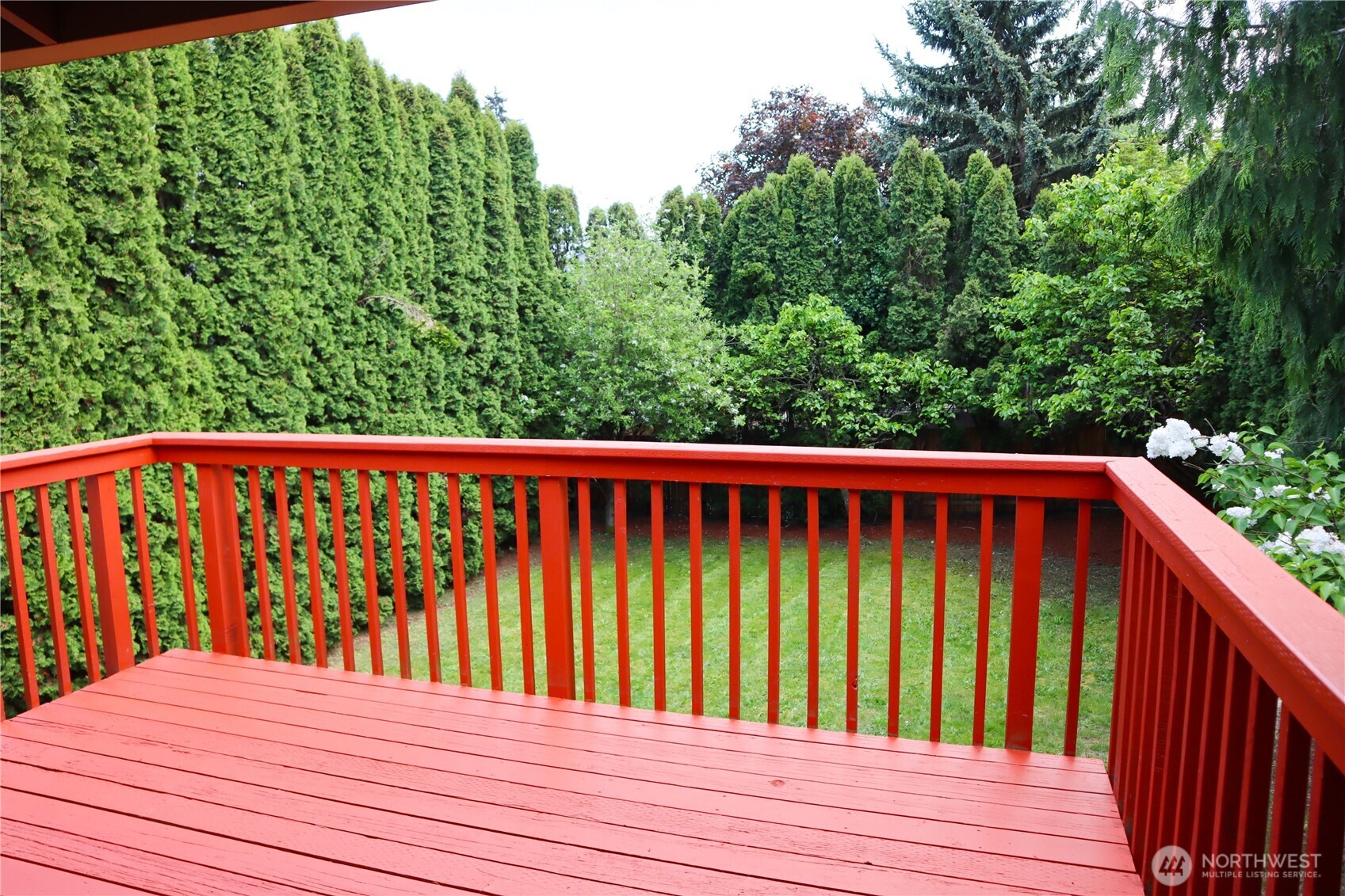 Here's a view out to the backyard from the kitchen and dining area leading out to the deck.  Plenty of space for seating.