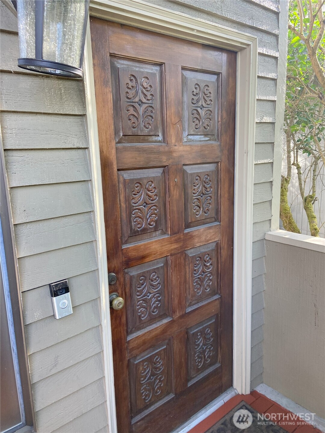Beautiful solid wood front door welcomes you home.
