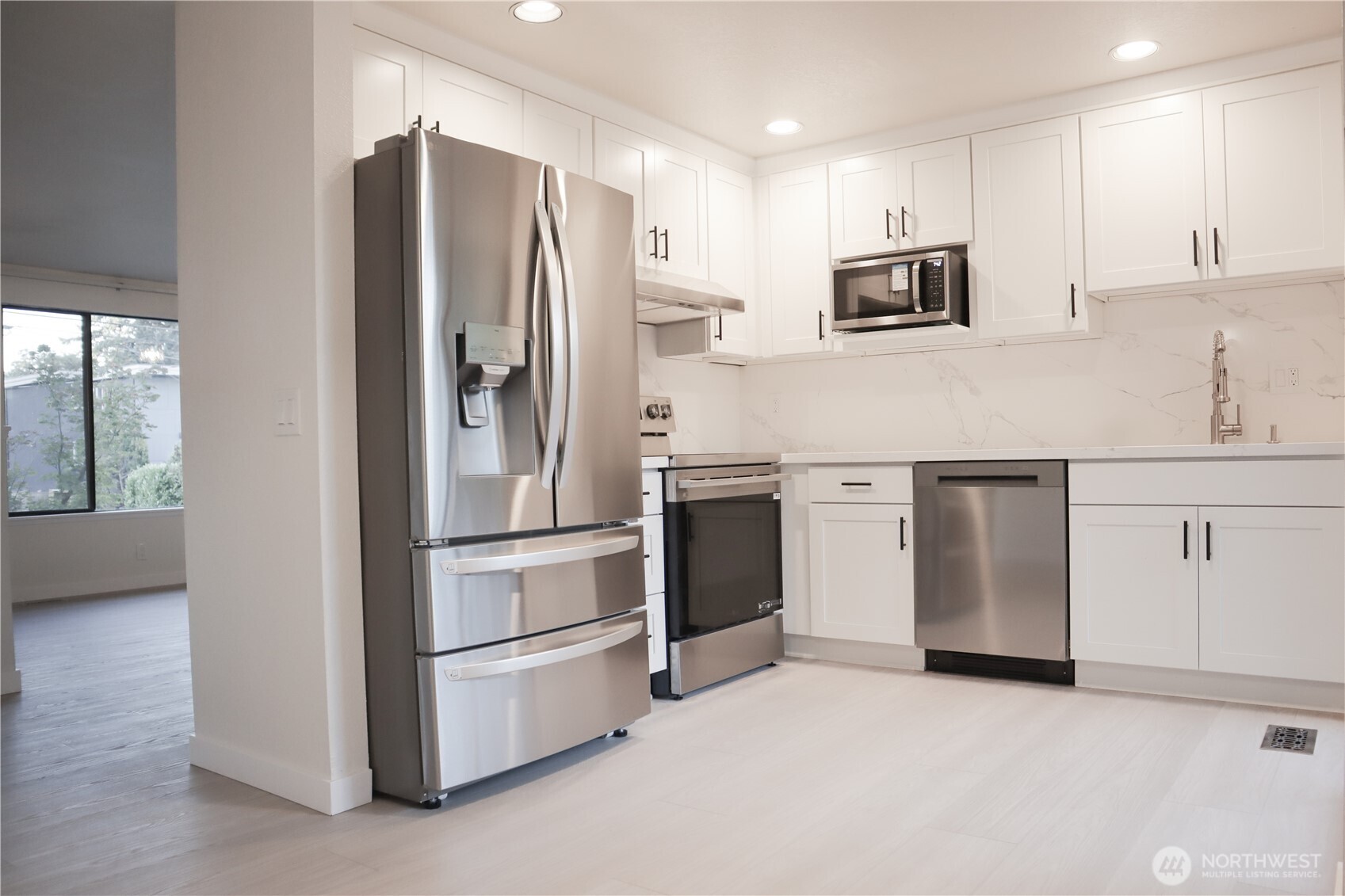 Totally updated kitchen!! Brand new cabinets, quartz countertops, fixtures, hardware, and stainless steel appliances.