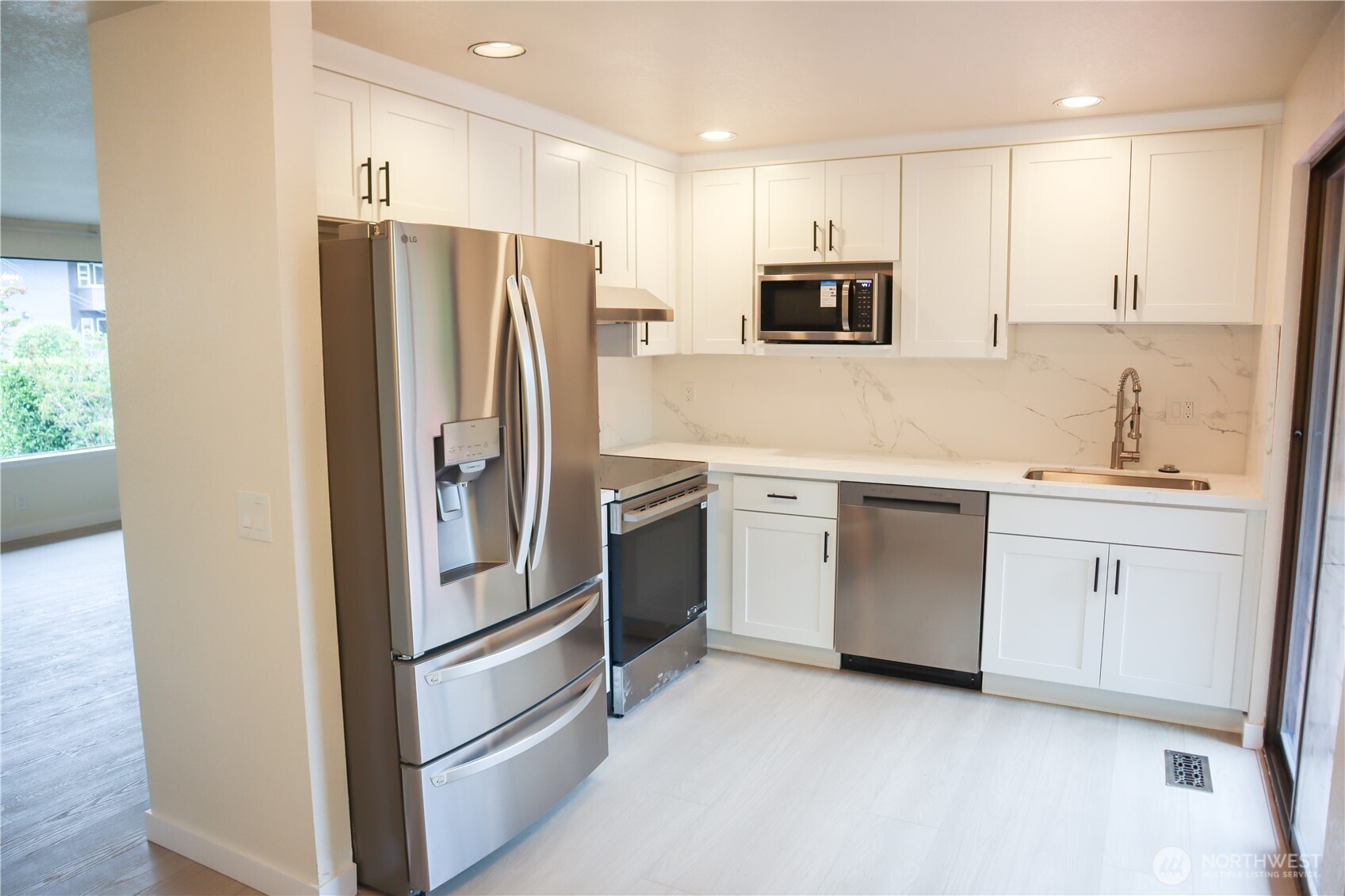 Nice flow through kitchen and dining room out to back deck.