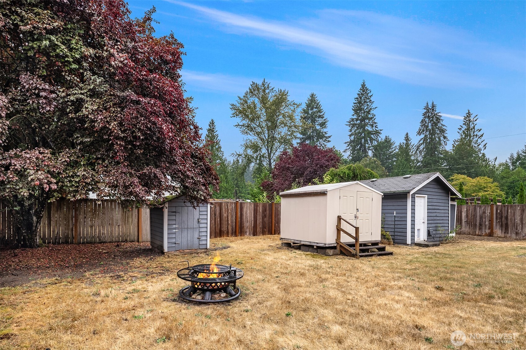 Look at the multiple outbuildings! Store everything you need to enjoy the vast back yard!