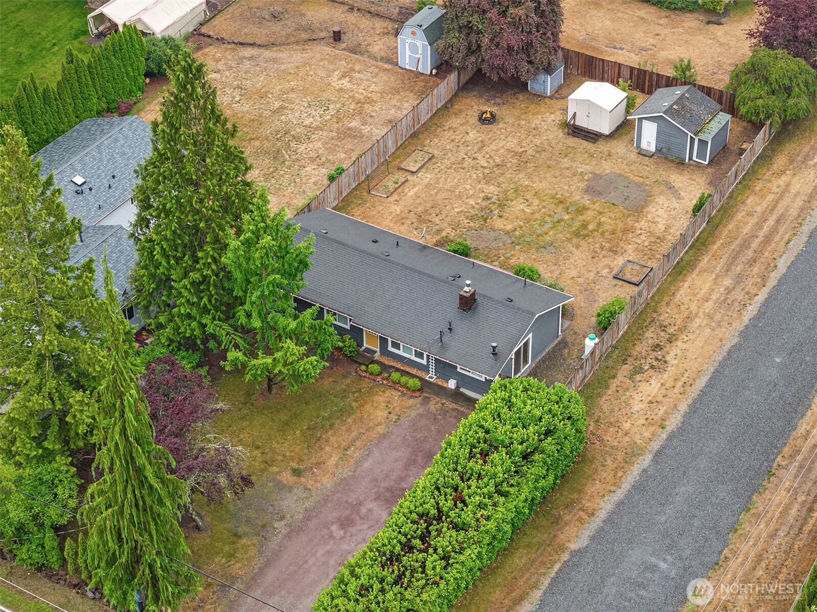 The entire huge back yard is fenced for your privacy and pets. There is a veritable plethora of garden space to grow whatever crops you hanker for.