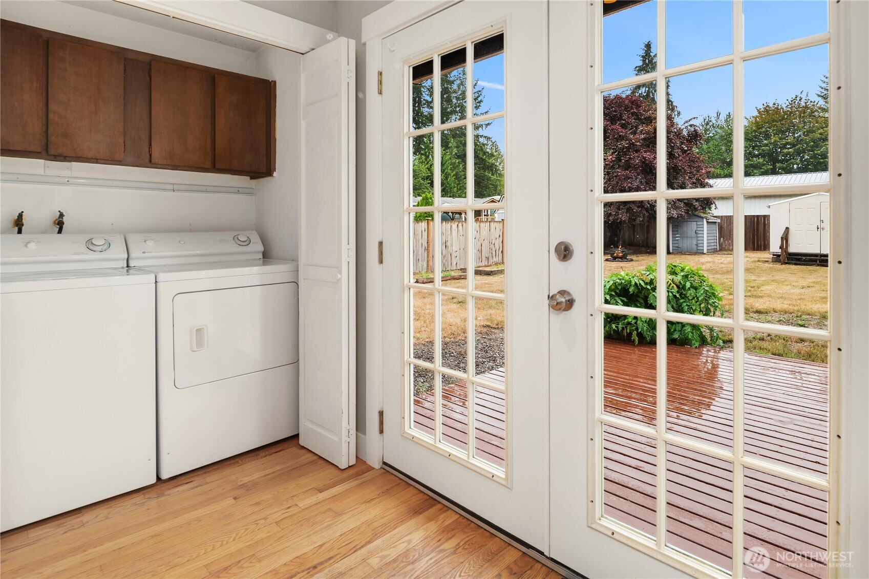The laundry closet is easily hidden away out of sight, or open to space for sorting. So brightly lit with glass French doors, matching colors or spotting touchup details in the laundry will be a breeze.