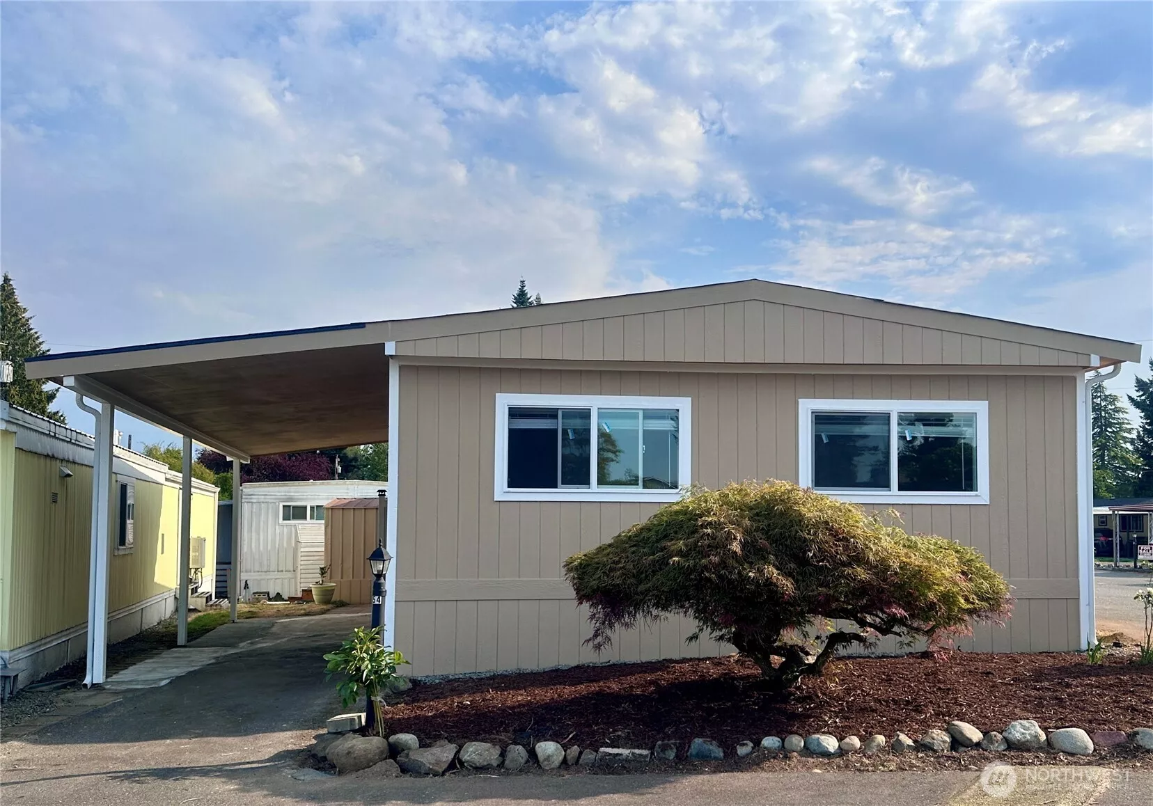 Inviting front view of this spacious double-wide manufactured home