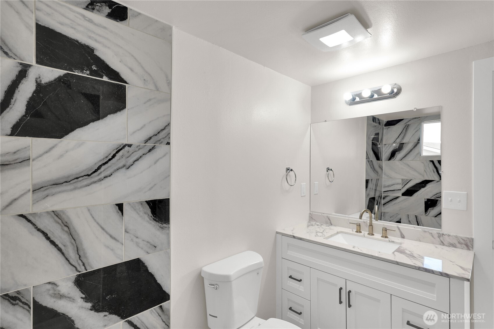 Beautifully updated vanity with plenty of counter space.