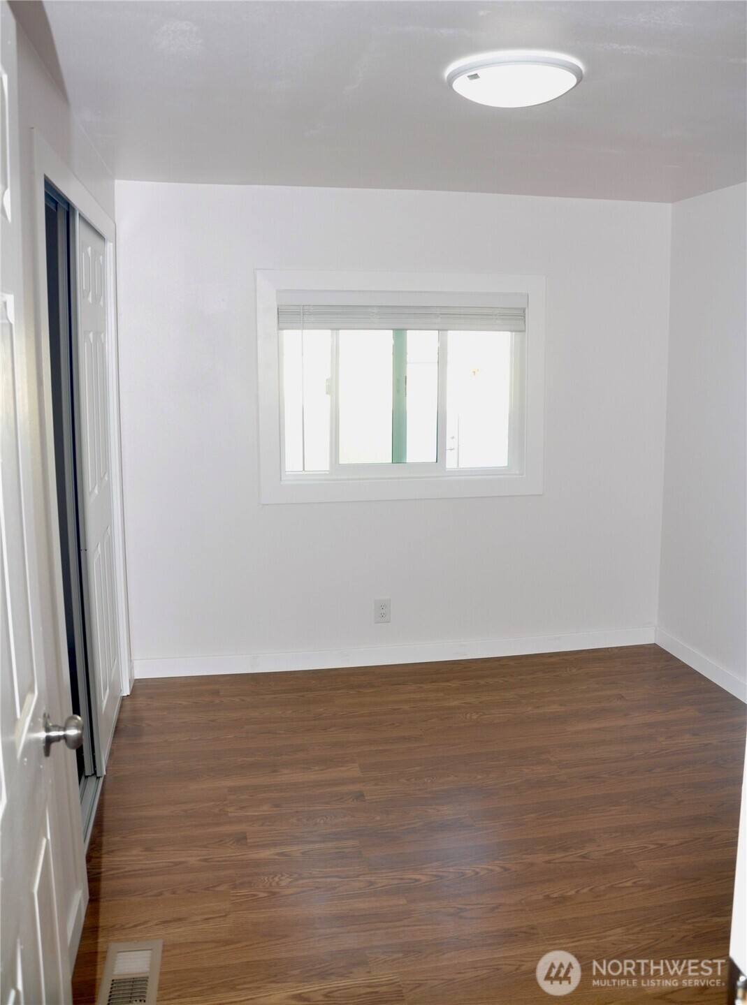 Comfortable second bedroom with ample room to personalize.