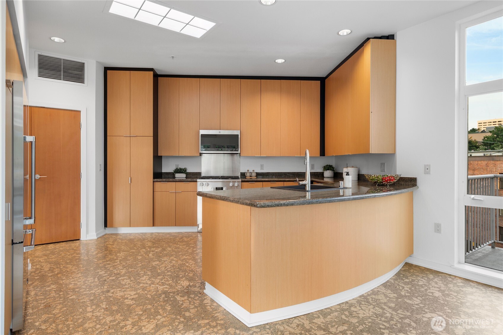 A chef -inspired kitchen showcases premium appliances by Miele, and Fisher & Paykel