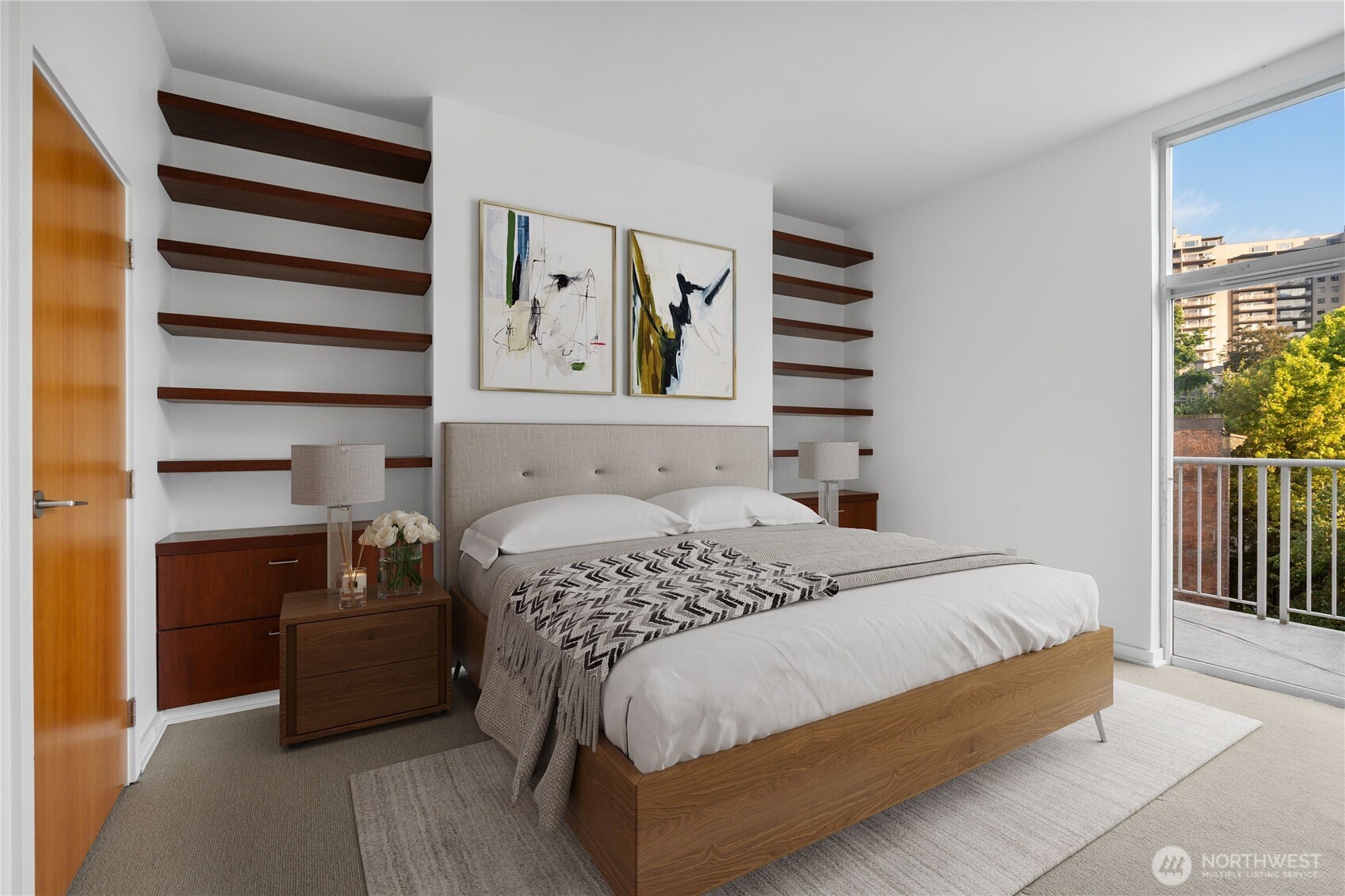 Your secondary bedroom is just across the hall from primary and has its own private balcony, walk in closet with sleek, built in shelving.