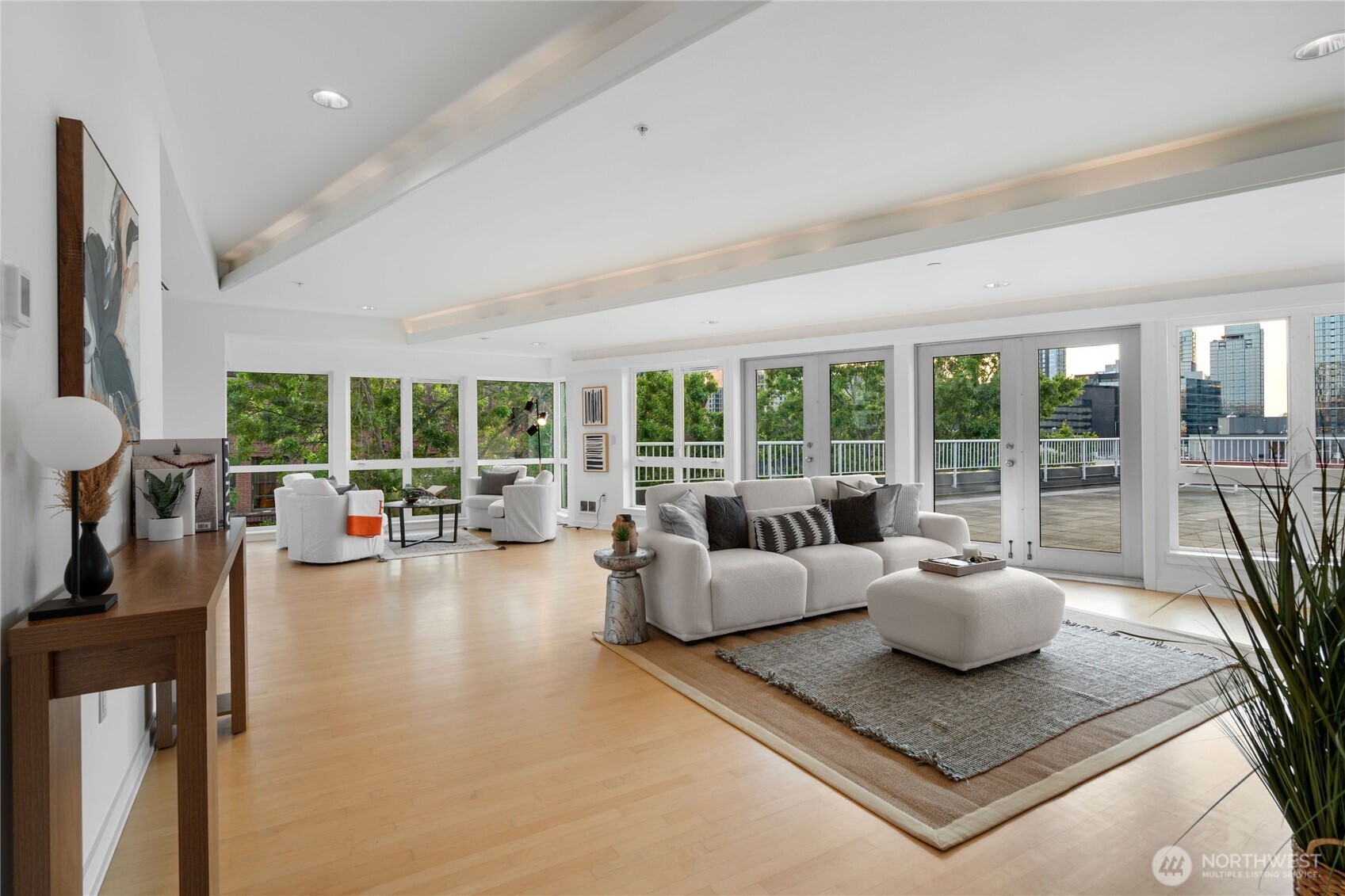 Sophisticated open-concept living is enhanced by stunning maple hardwood fkoring, and floor to ceiling windows bathing the space in natural light.