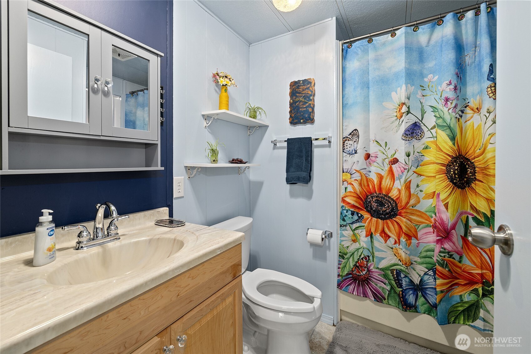 Guest Bathroom with new paint, flooring and storage!