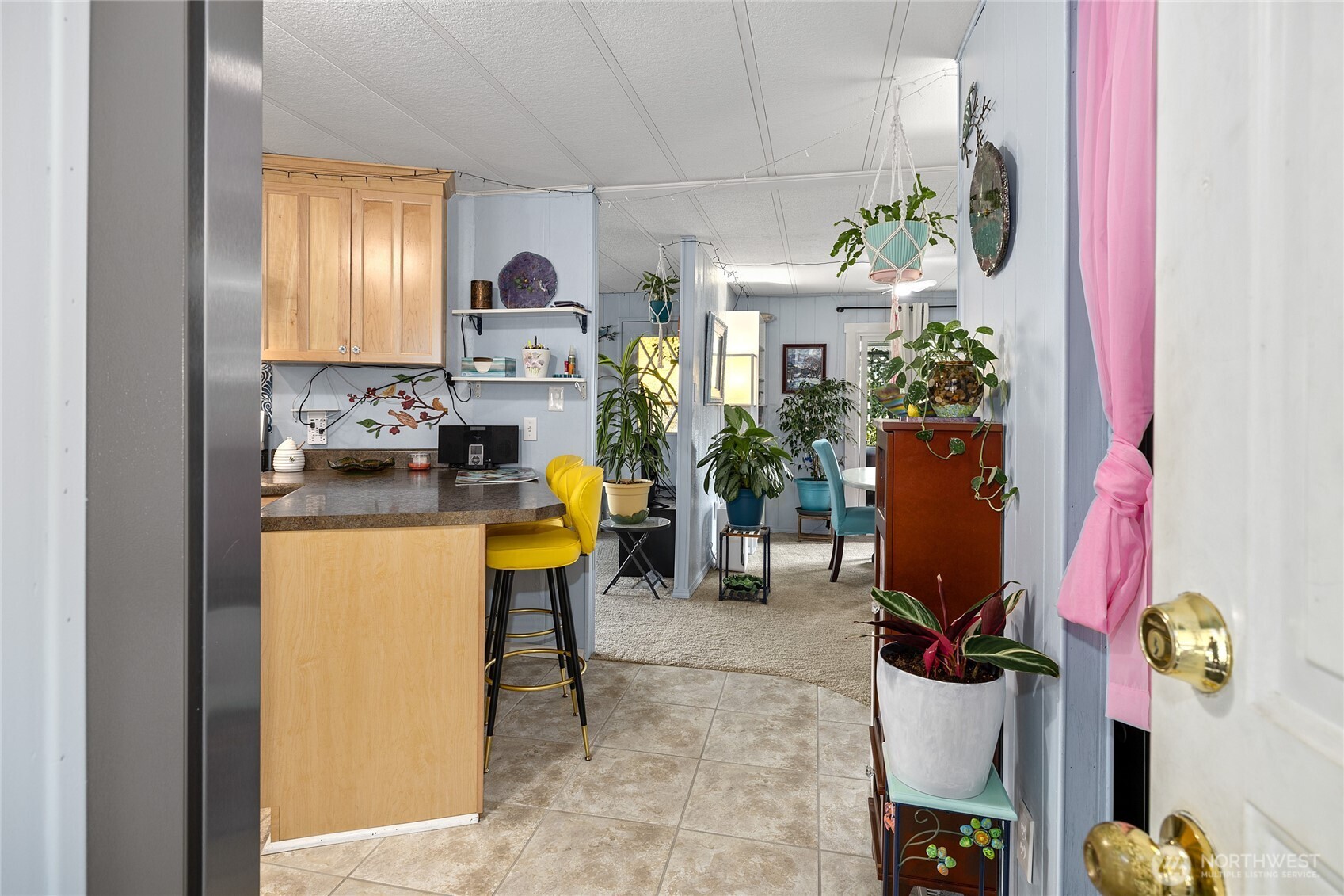 Your Home! Entry from carport back porch area. Light and Bright! New flooring and paint.