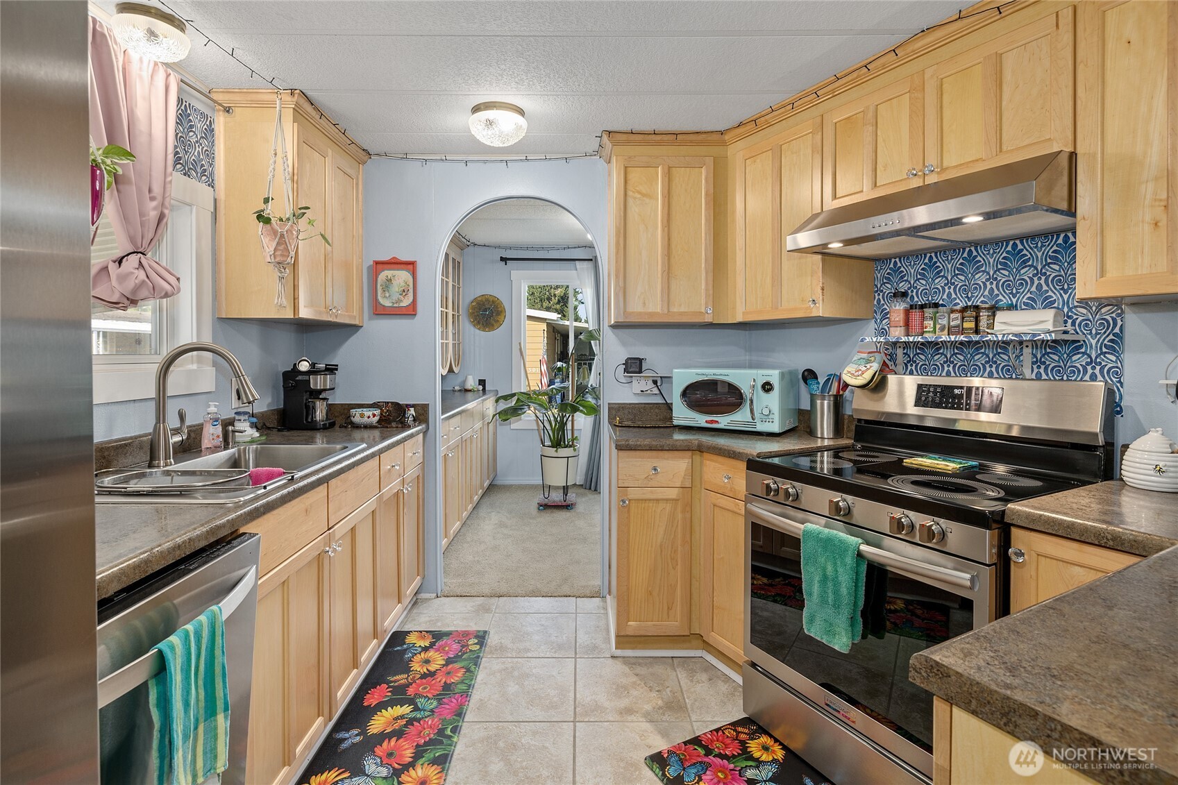 Kitchen features real wood cabinets, NEW stainless steel appliances and tons of space!