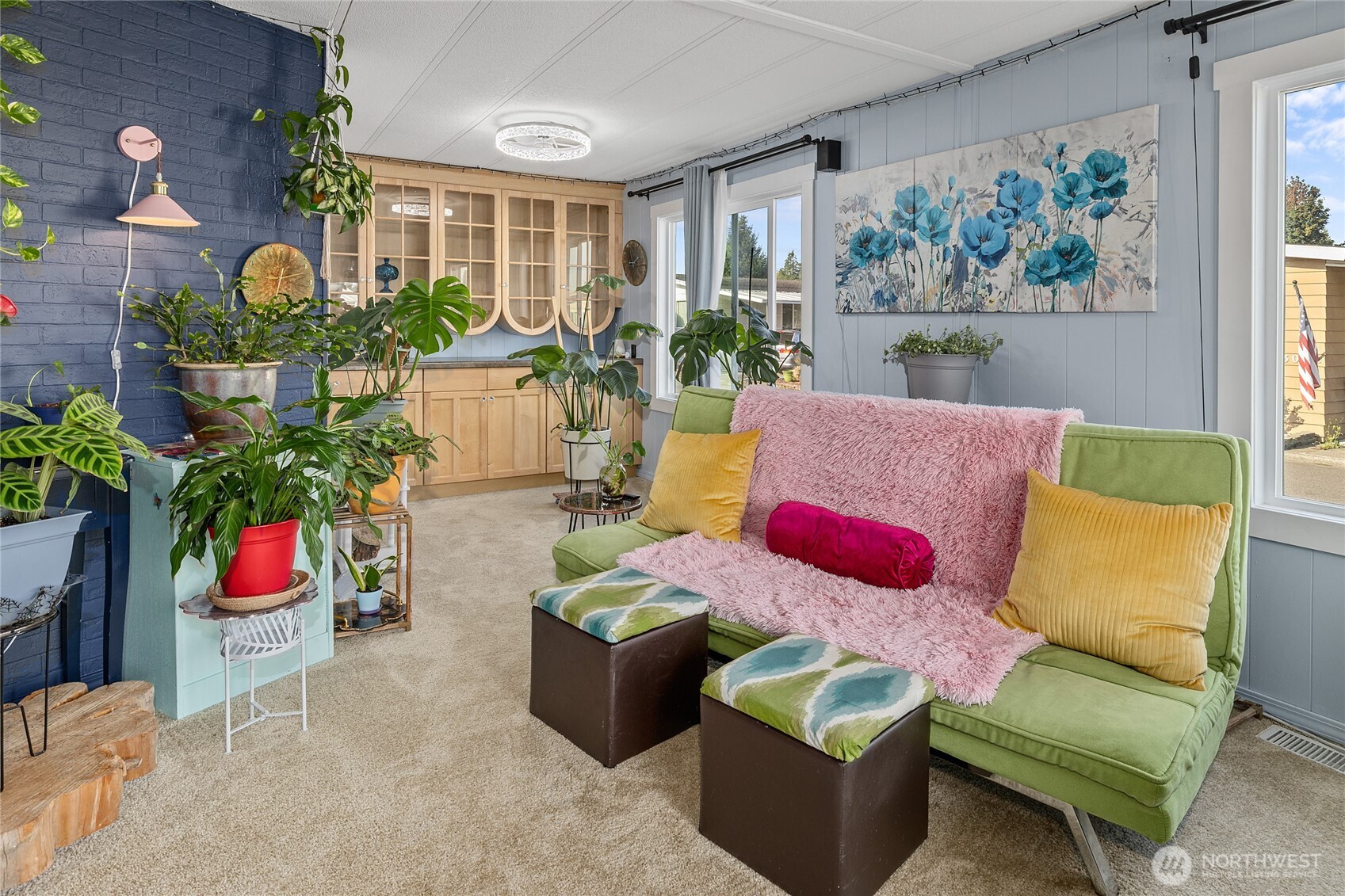 Dining Room features built-in real wood cabinet and hutch for all your storage needs, new ceiling light/fan and TONS of natural light!
