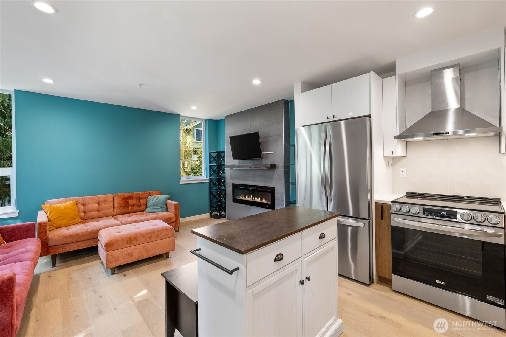 1st floor 3/4 bath w/shower, floating vanity & custom lighting with motion sensors for under cabinet & soap niche lights!