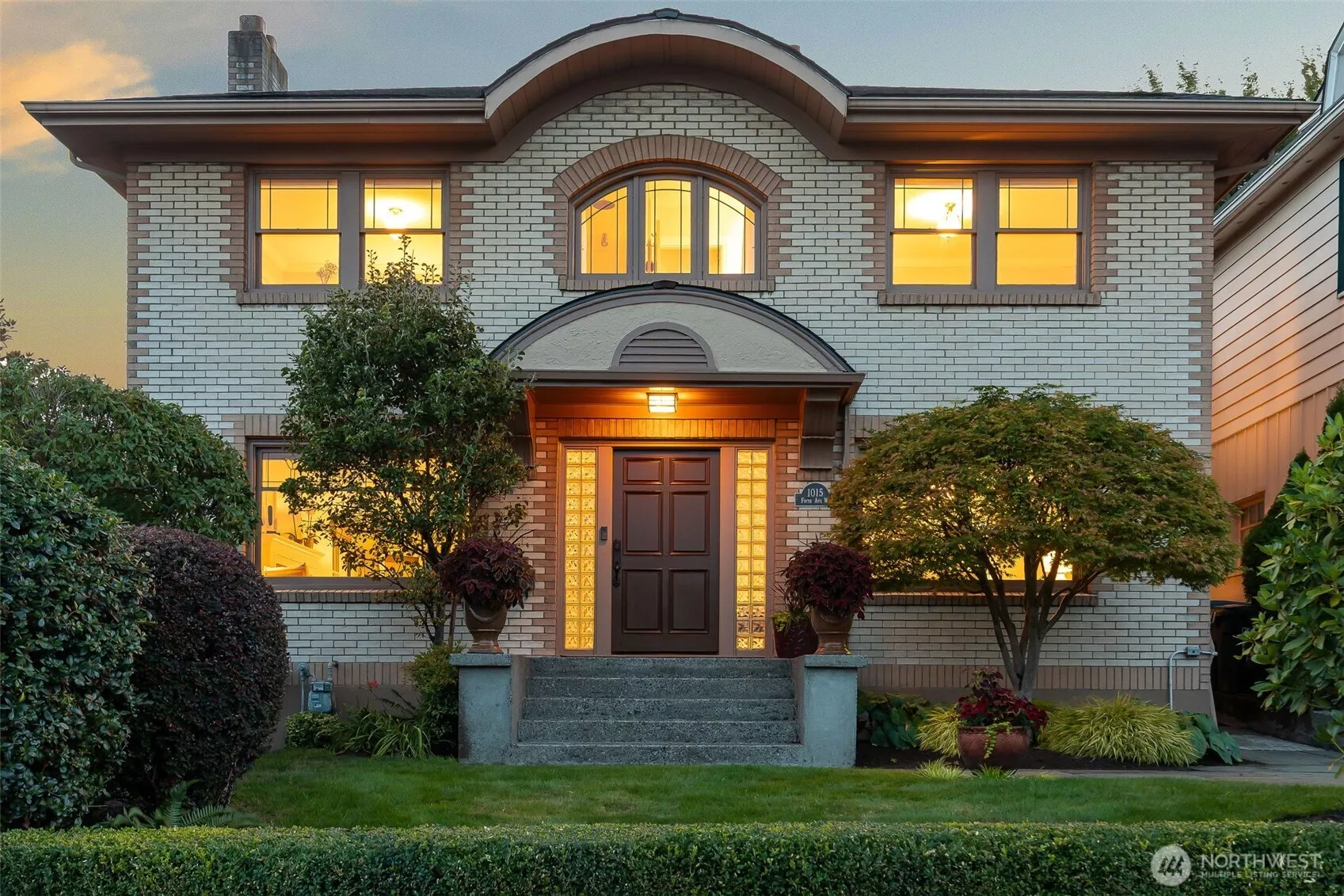 This stately brick colonial has great street presence.  It's perched on the west side of 5th Ave W on the south slope of Queen Anne, just a few blocks from iconic Kerry Park.