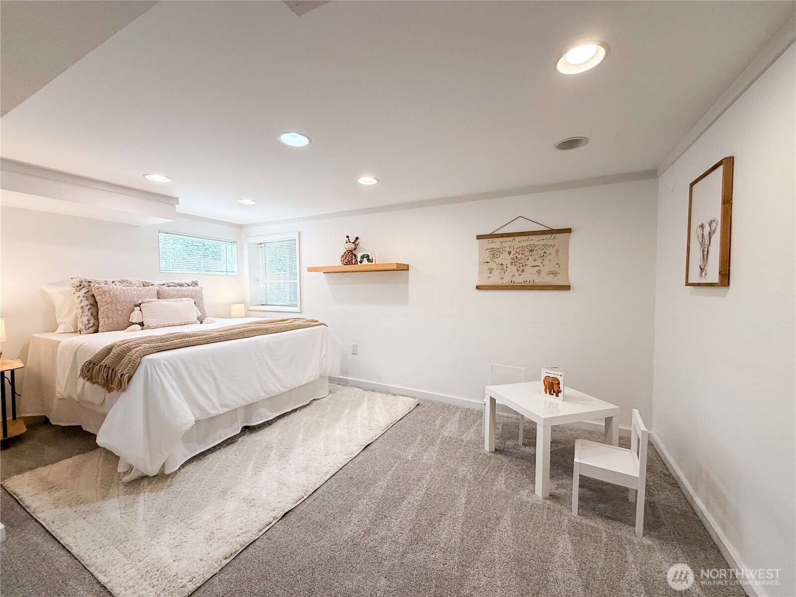 Large bedroom with fresh paint and newer carpet.