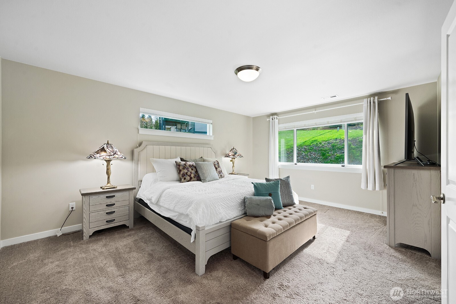 Primary bedroom with 5 piece en suite bath and walk-in closet.