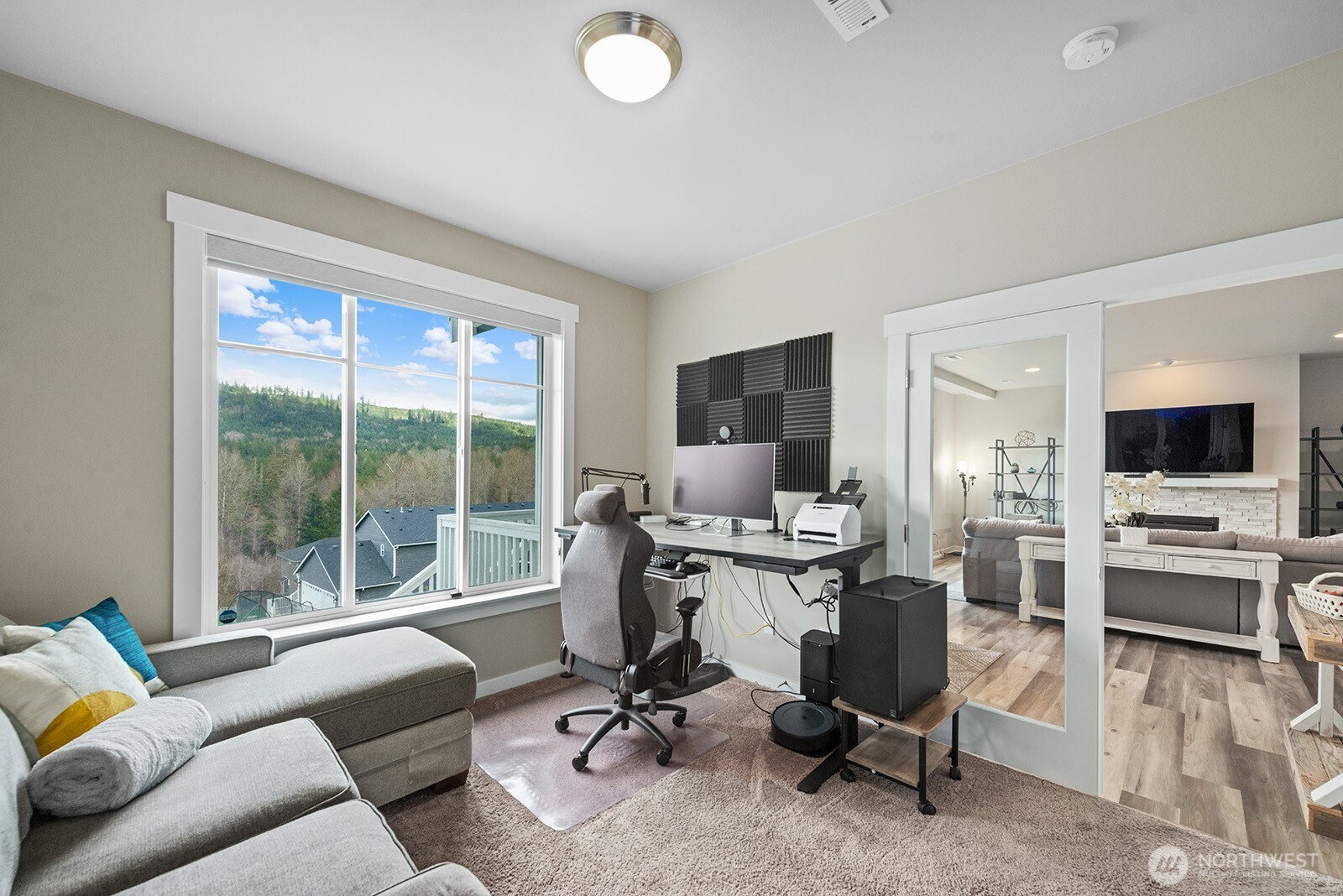 Main floor office with plenty of space for a desk and seating area.